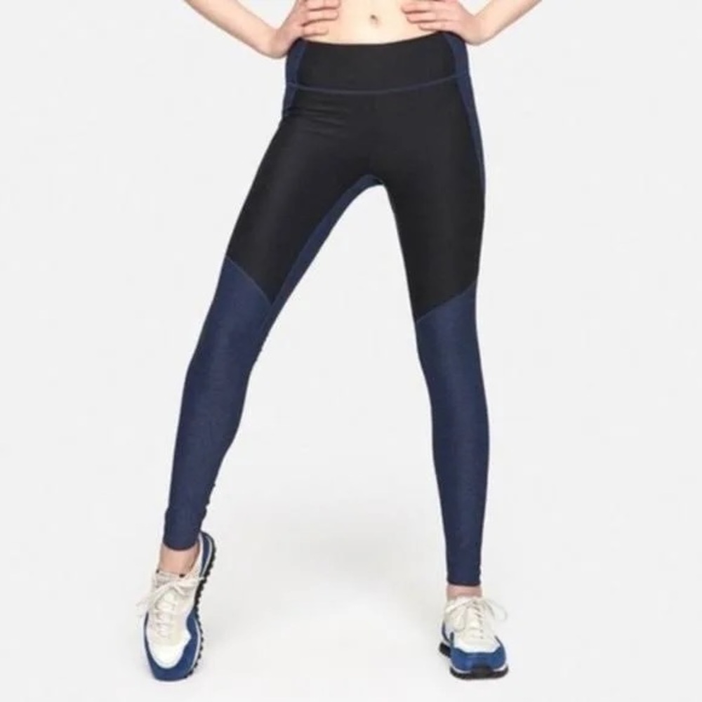 outdoor voices warm up leggings in a two-tone blue & black color